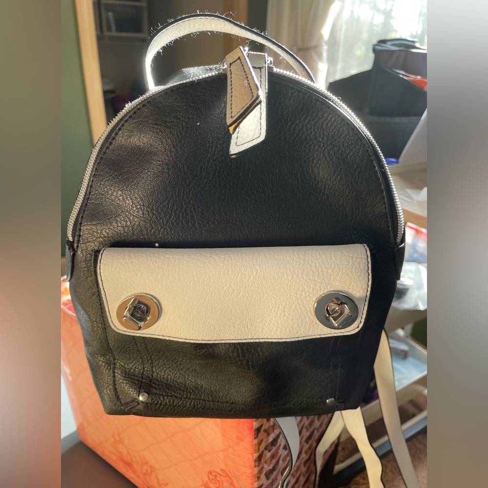 Vegan leather medium size back pack, black & white.